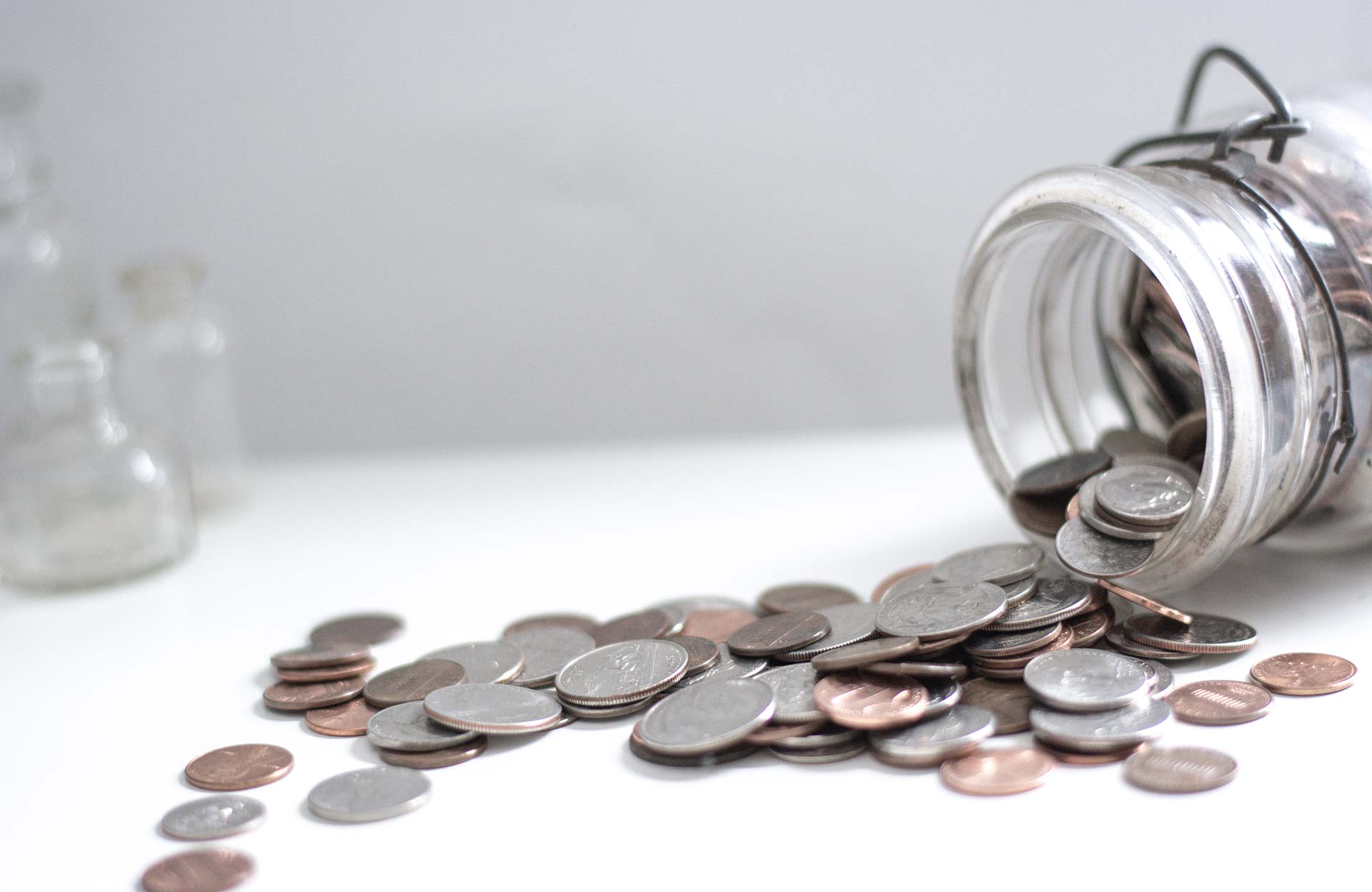 coins falling out of jar